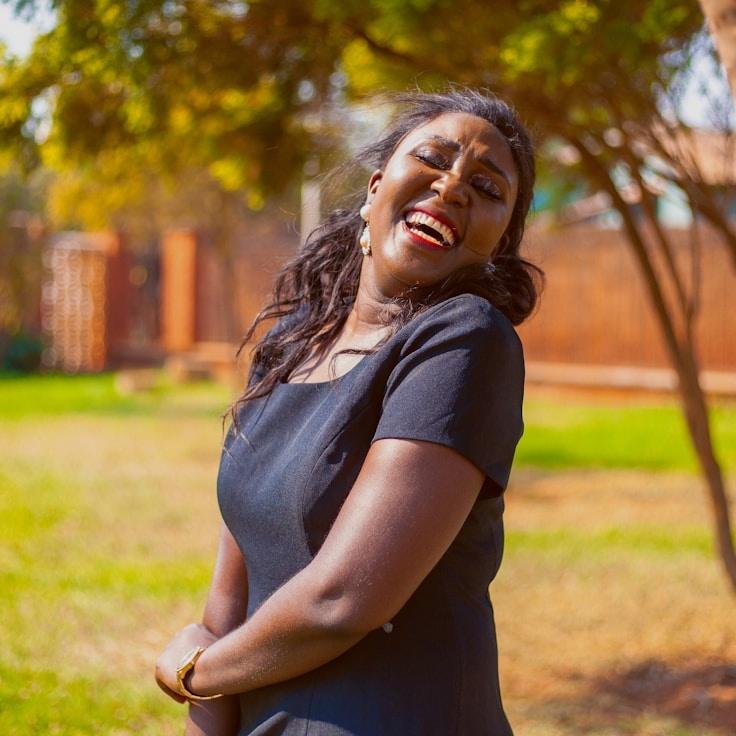 Avery Chen, Lead Design Curator at AmberCandleRoute, reviewing corporate floral arrangements
